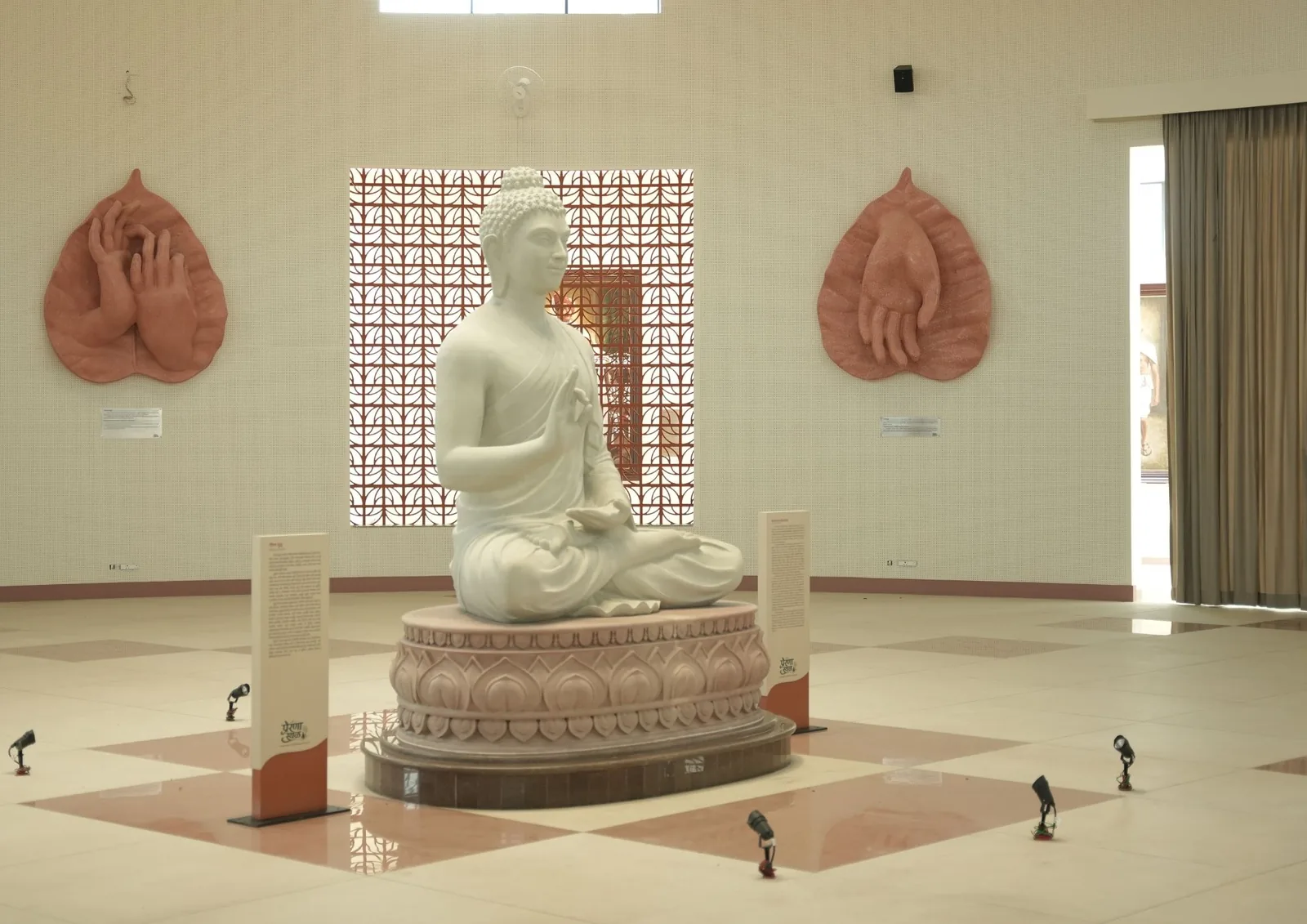 The Buddha statue on its lotus pedestal, seen from the left